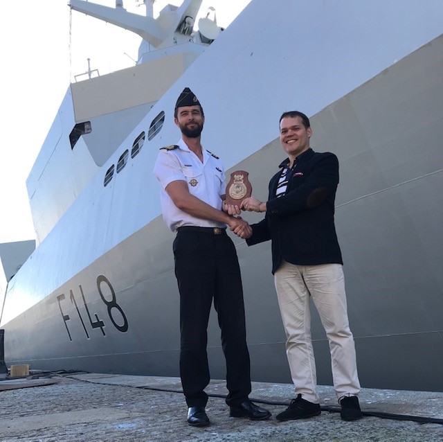 Honour - Commander Leon van Zyl presenting Claudio Chiste with the Ship